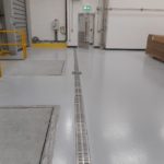 Double Contained Stainless Steel Channel Connected to Double Contained Polypropylene Underground Pipework